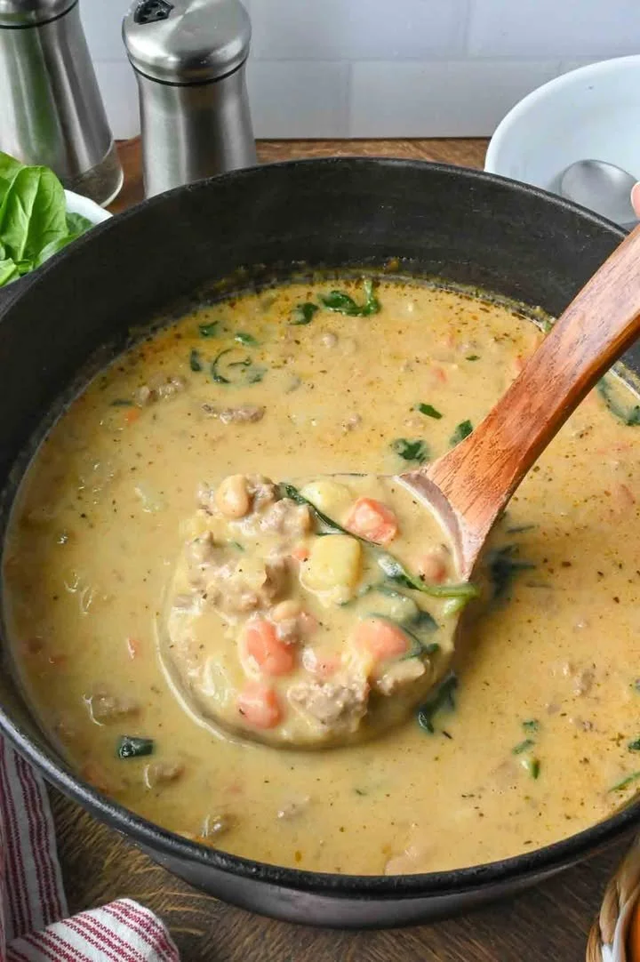 Italian Sausage White Bean Soup Bowl of Italian Sausage White Bean Soup garnished with herbs