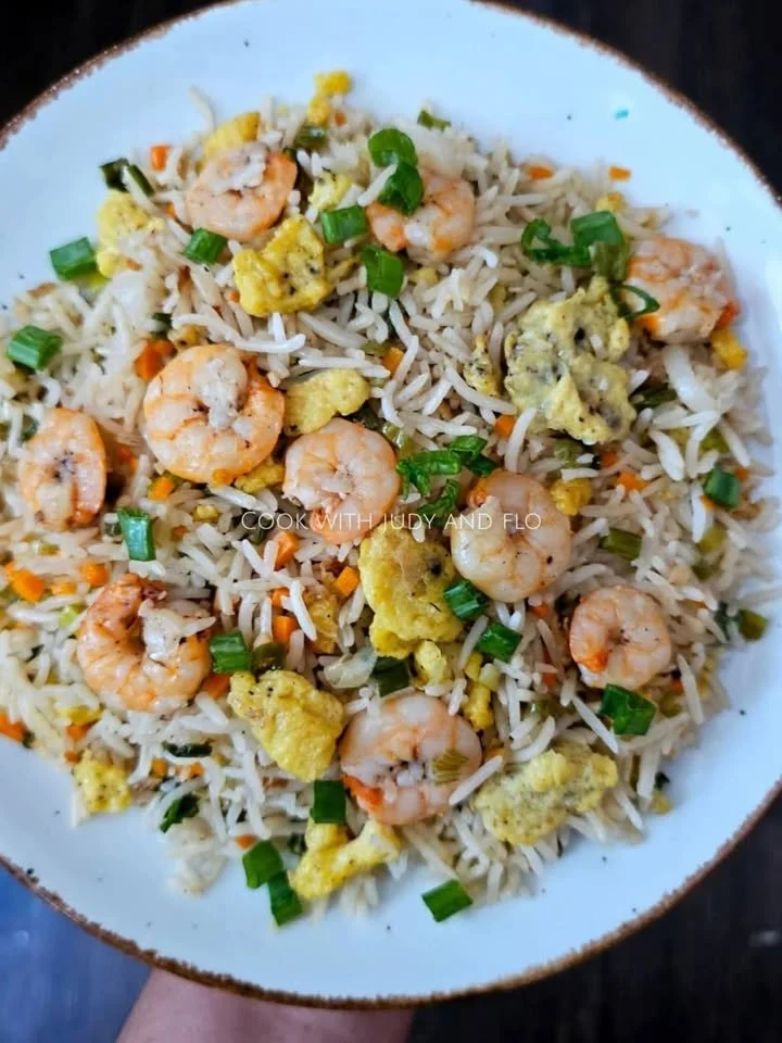 Prawn Fried Rice Plate of prawn fried rice garnished with vegetables and herbs
