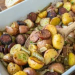 home Delicious Sausage Potato Green Bean Casserole baked to perfection.