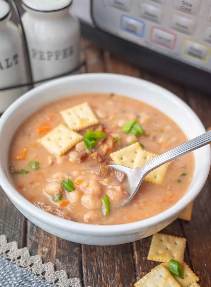 Delicious slow cooker bean soup simmering in a pot, perfect for cozy meals.