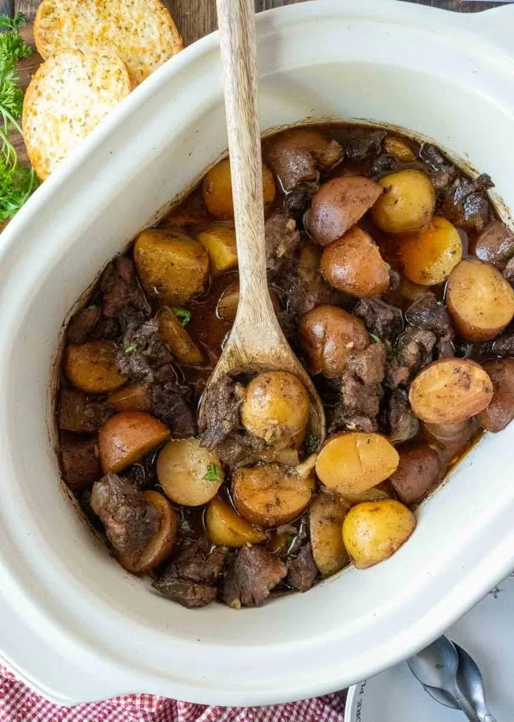 Delicious Slow Cooker Garlic Butter Steak Bites served with tender potatoes