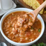Delicious slow cooker pinto bean soup with chorizo in a bowl