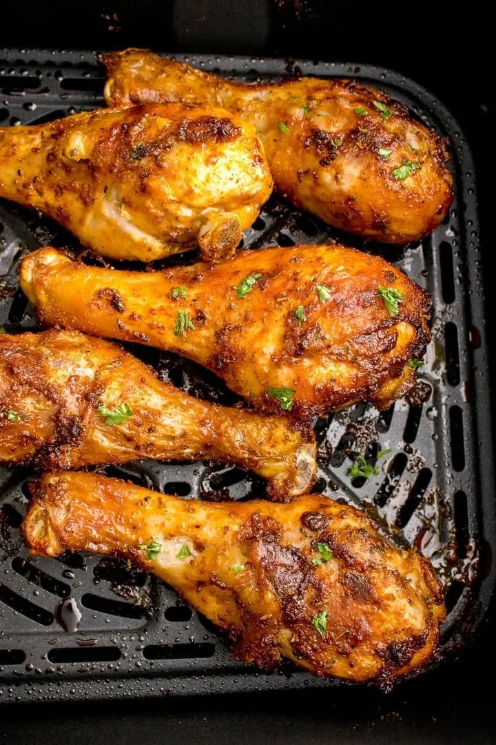 Sweet and spicy air fryer chicken legs served on a plate