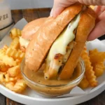 home Turkey French Dip Sandwich with au jus for dipping on a plate