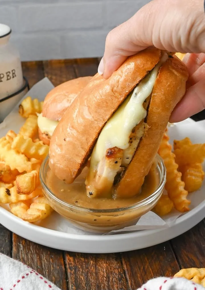 Turkey French Dip Sandwich with au jus for dipping on a plate