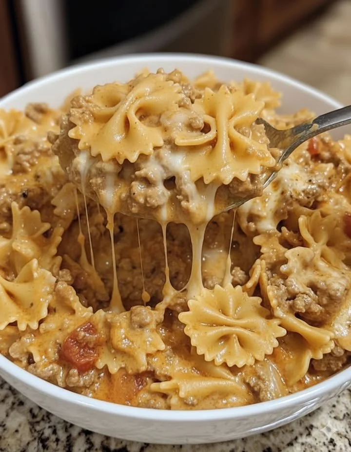 home Delicious Velveeta Beef Pasta with Bowtie Noodles in a creamy cheese sauce.
