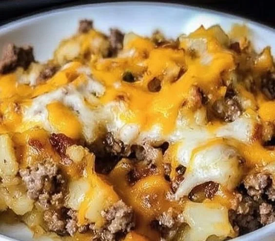 Cauliflower and ground beef hash served in a skillet, healthy breakfast dish