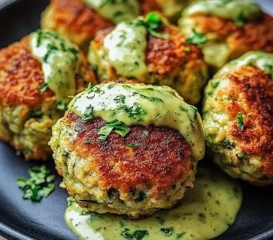 Delicious salmon balls served with a vibrant avocado sauce
