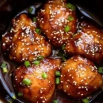home Delicious Slow Cooker Mongolian Chicken served with rice and vegetables.