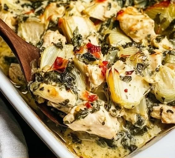 Delicious Spinach Artichoke Chicken Bake topped with creamy spinach and artichokes.