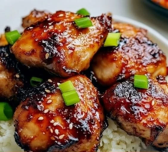 Sweet Chili Air Fryer Chicken Thighs garnished with fresh herbs