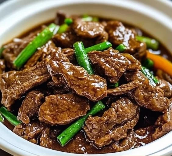 Delicious slow cooker Mongolian beef served with vegetables